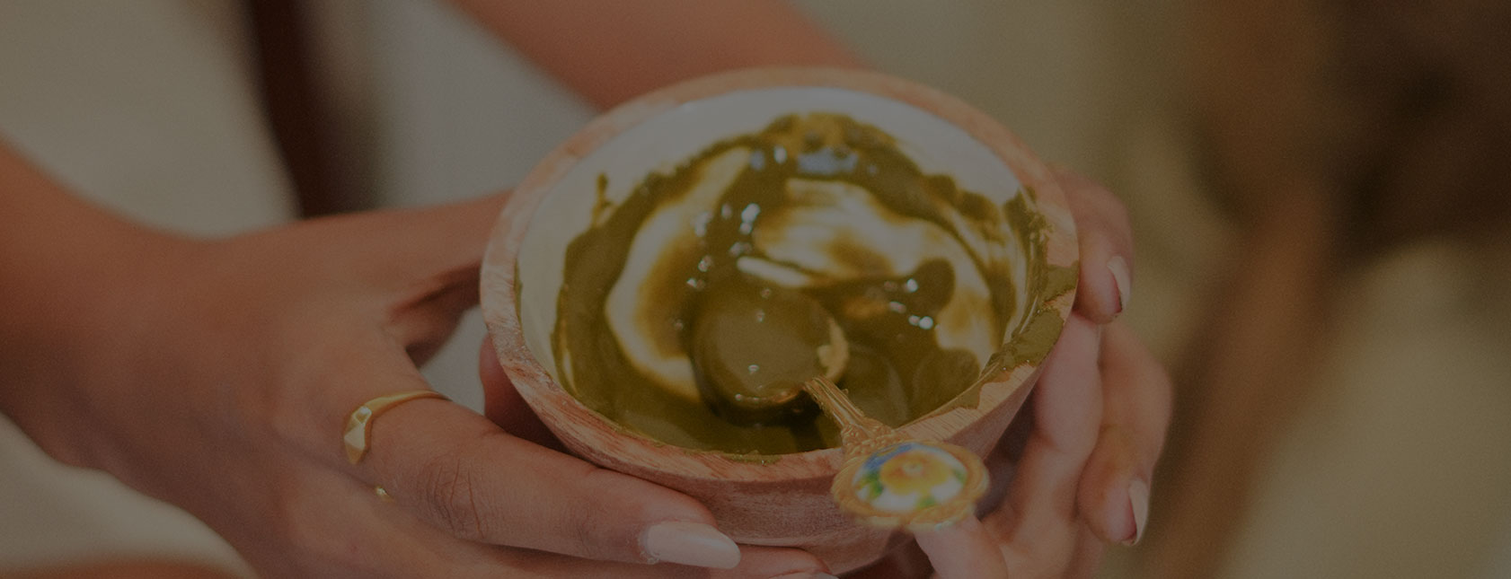 Hands holding bowl with what appears to be authentic ayurvedic legacy in banner image on padma home page